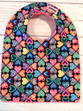 Colorful Hearts on Black with Pink Terry Baby Bib